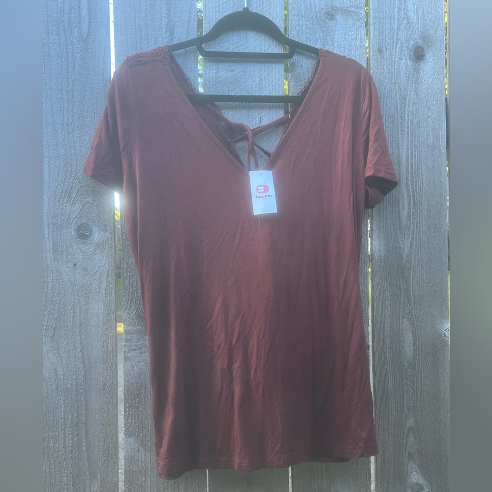 ‘Hot Chocolate’ colored v neck blouse with lace detail down the back.